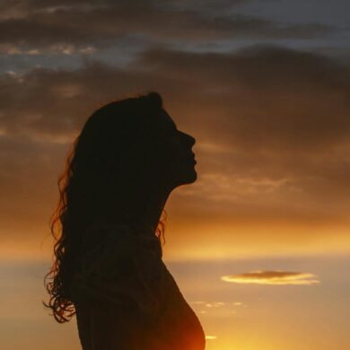 woman silhouette at sunset - horoscope